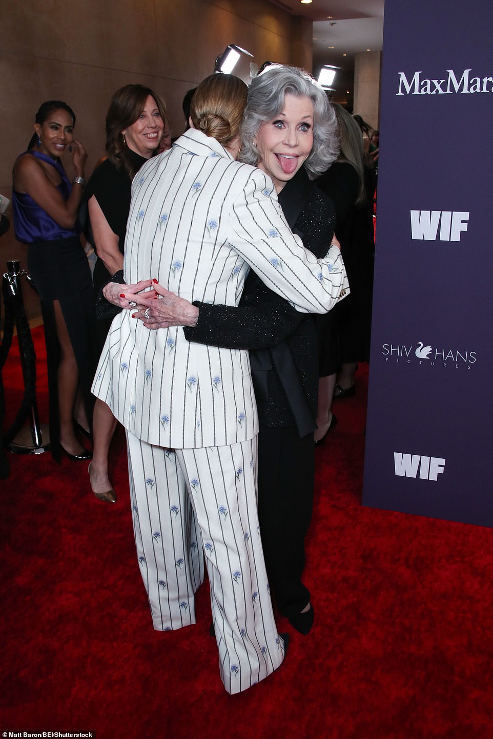 The 86-year-old playfully stuck her tongue out at the cameras while hugging Winslet.