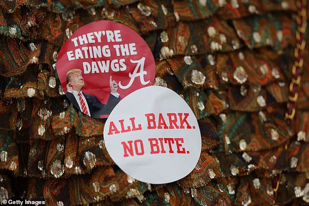 Alabama fans made these Trump-themed stickers when he visited the Gerogia game