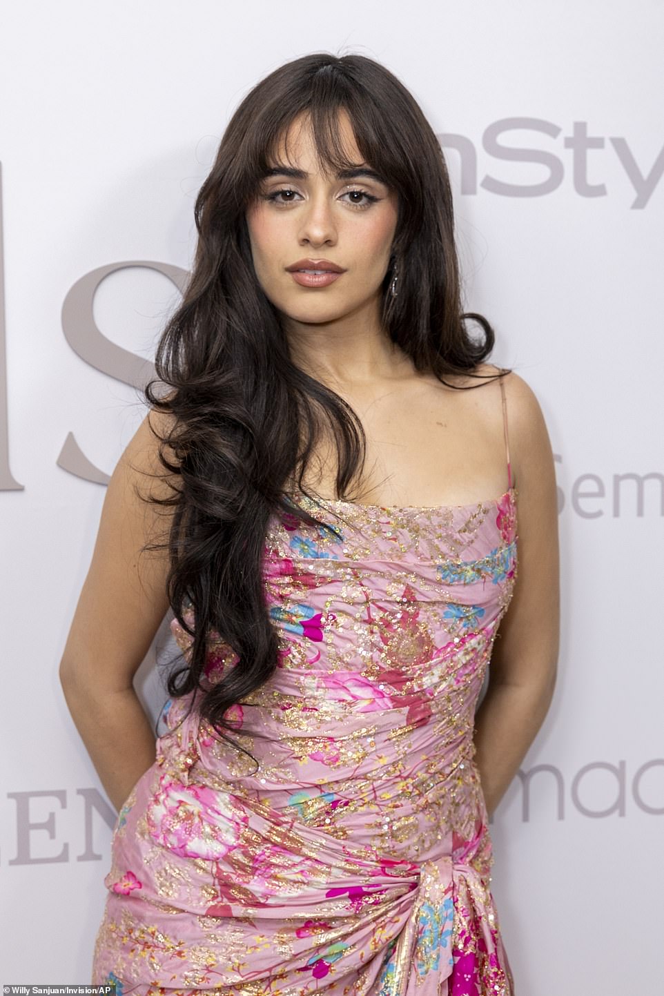 Cabello's enviably long hair fell to her waist in voluminous, curly locks.