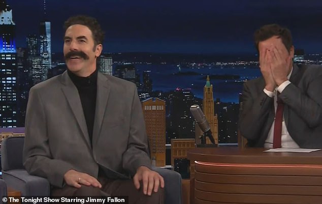 Cohen then donned a gray suit jacket and a mustache while transforming into Borat, before attempting to kiss Fallon.