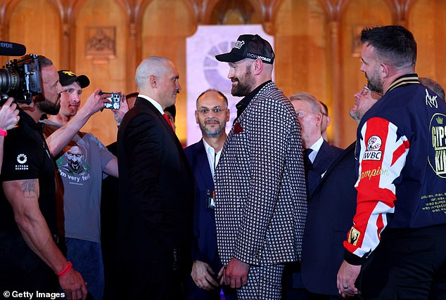 Usyk (left) and Fury faced off at a press conference on Wednesday ahead of their rematch.