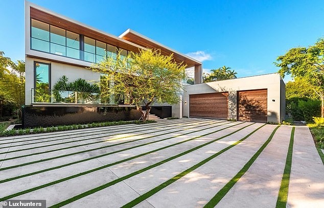 The spacious driving space in front of the megahome with smart garages