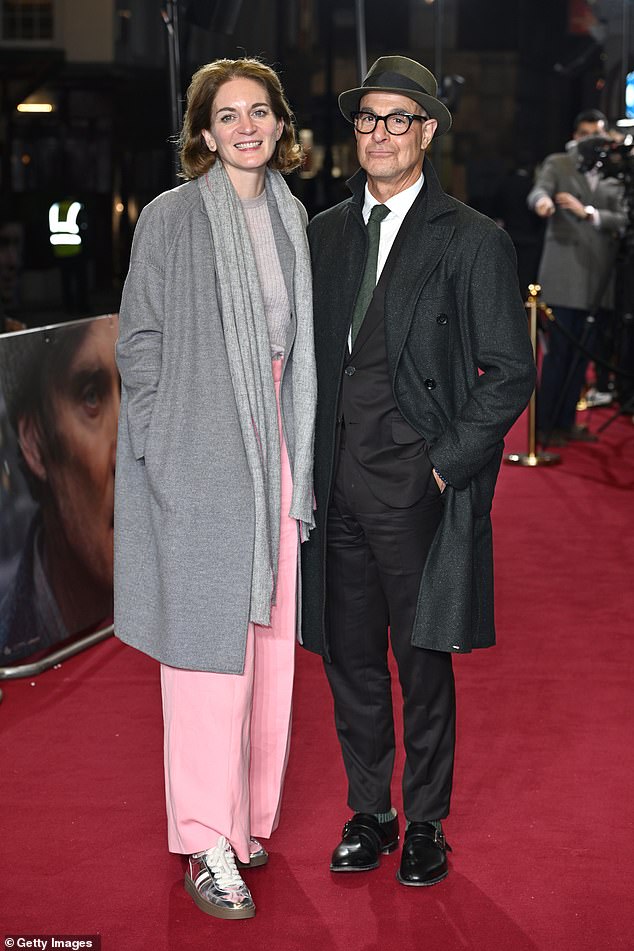 The interpreter looked in love with his wife at the event to celebrate the historical drama film starring Cillian Murphy.