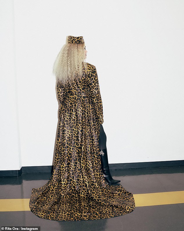 She donned a leopard print coat and matching hat to finish off the look.