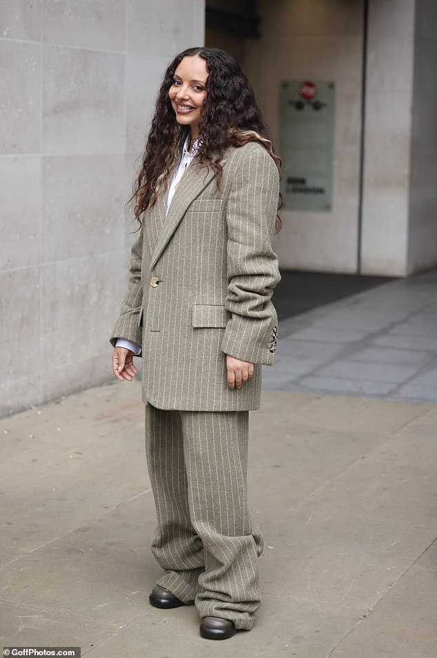 After Jade's performance, she left the BBC studios wearing an oversized grey-green striped suit which she paired with platform shoes.