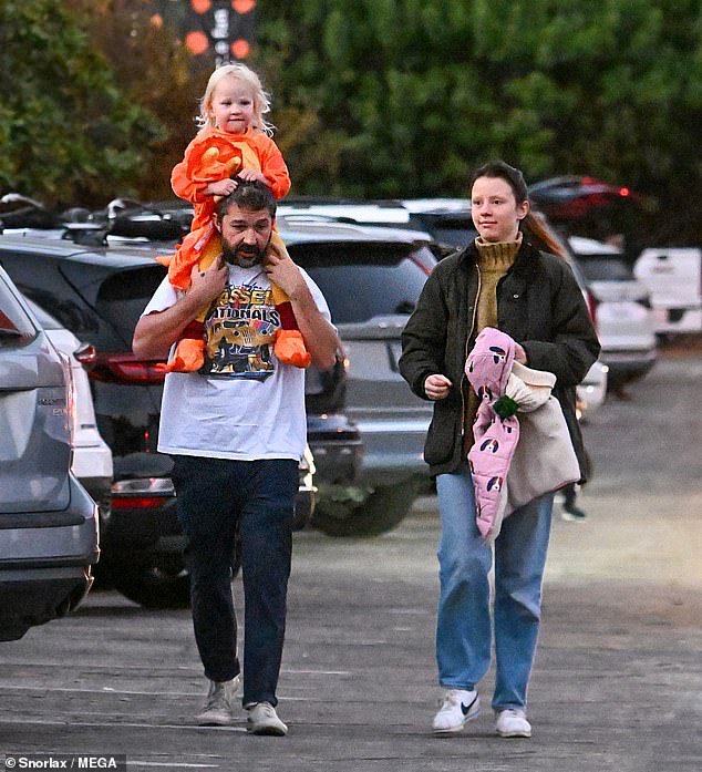 LaBeouf sported a white graphic t-shirt, pants and sneakers.