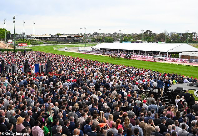 A packed crowd is set to watch the live Cox Plate, which was first held in 1922 (pictured, racegoers trackside last year)