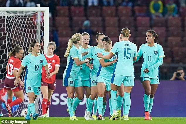 Australia's Caitlin Foord celebrating her goal with her teammates in the draw with Switzerland