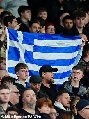 The Greek flag has blue and white lines with a cross in the upper left corner.