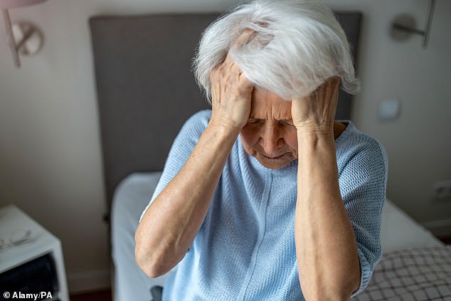 An analysis suggests that the posture people adopt while using their devices can reduce blood flow to the brain, leading to cognitive decline (File image)