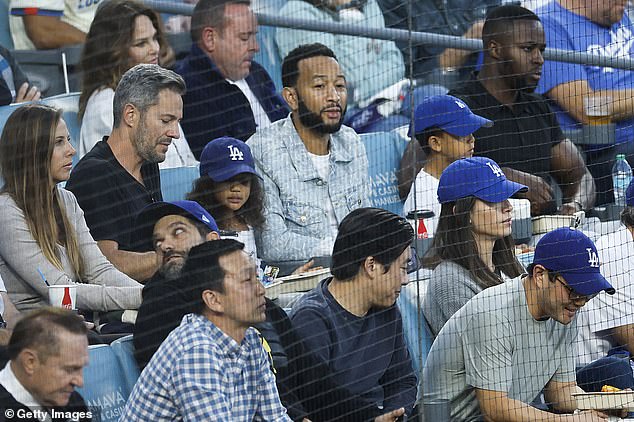 Singer John Legend was also at the game, as he sat with his children at Dodger Stadium.