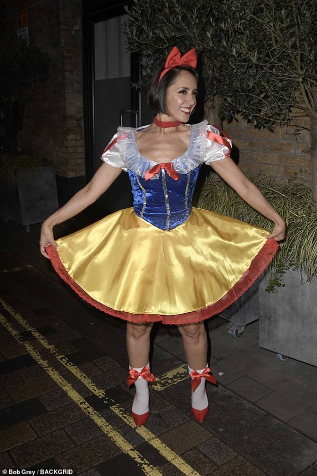 The former Strictly star wore a yellow and blue mini dress, complete with heels and a bow headband.