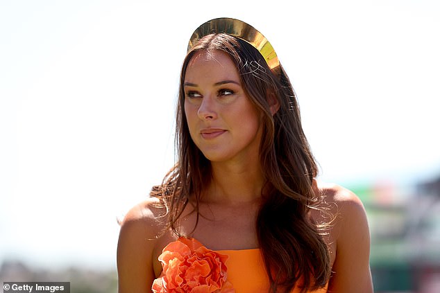 In keeping with the daring dress code, Brianna, 28, put on a sophisticated display in an equally vibrant orange sundress, adorned with huge flowers.