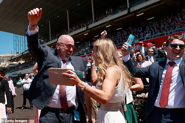 They were present at Cox Plate Day, which has a purse of $5 million and sees horses three years old and older race a distance of 2,040 meters (racegoers pictured)