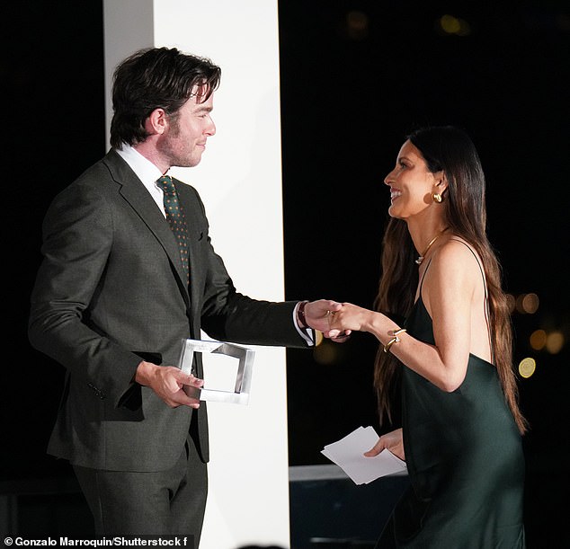 John presented Olivia with the Woman of Impact award at the October 24 ceremony.