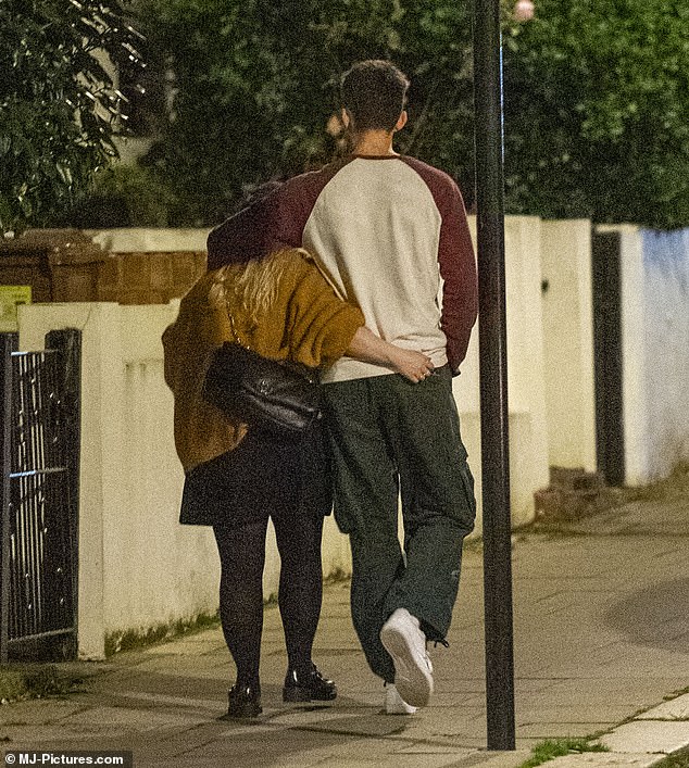 Nicola and Jake pictured cuddling as they walked home to the pub.