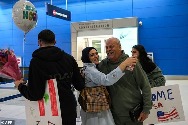 Micho Assi met his parents at the Detroit airport after they fled Lebanon