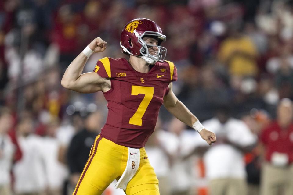 USC quarterback Miller Moss celebrates after the Trojans scored a touchdown against Rutgers on Friday at the Coliseum.