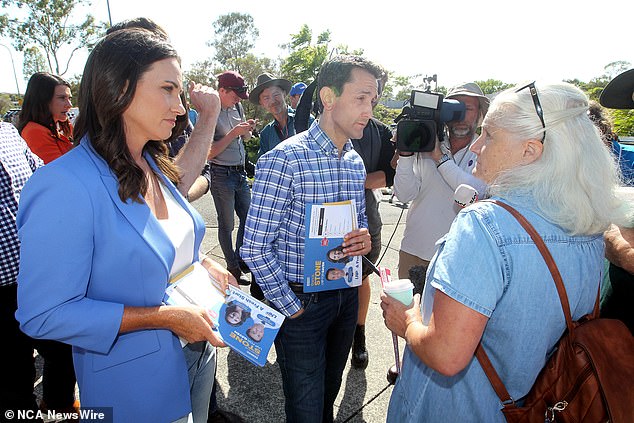 Ms Stone and Opposition Leader David Crisafulli face local resident Vicki Campbell on Saturday.