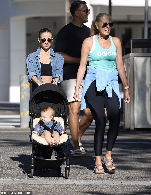 Lucy also wore a pair of sunglasses for the sunny day and sported a pair of silver and white running shoes.