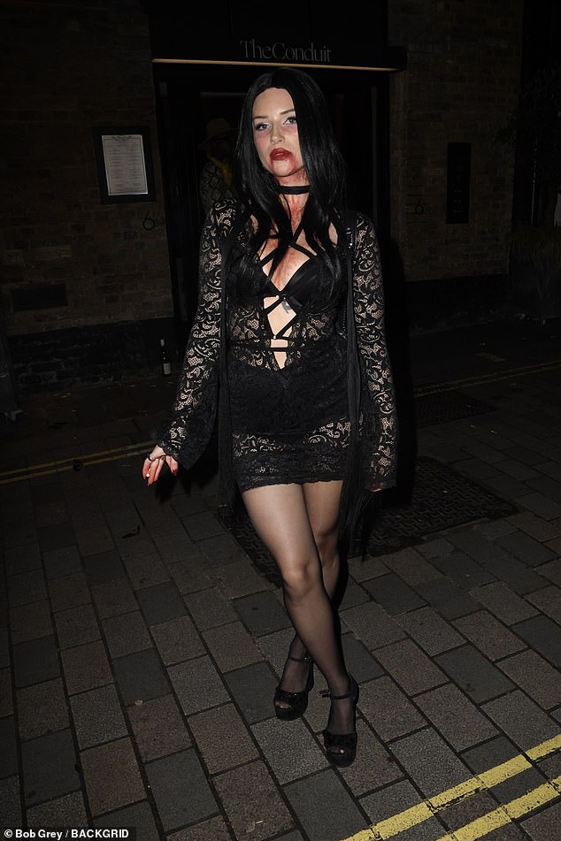 The model looked incredible as she headed to the event in a sheer black lace dress with a plunging neckline.