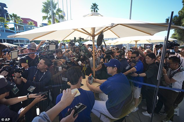 Ohtani is harassed by reporters before Game 1 of the World Series against the Yankees