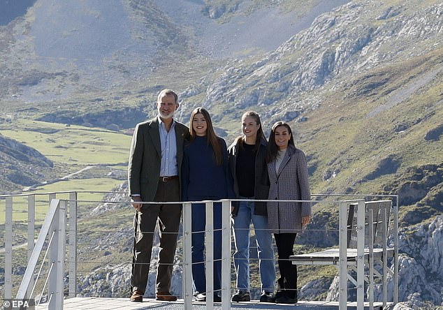 King Felipe (left), Queen Letizia (right), Crown Princess Leonor (second from right) and Princess Sofia pose during their visit to the town of Sotres.