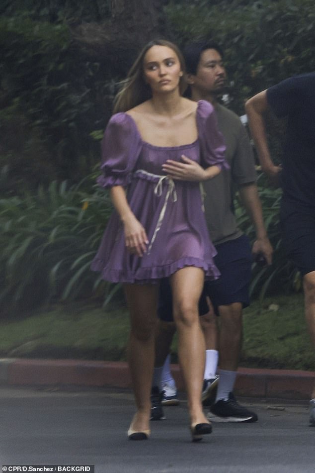 For another look, Lily-Rose also donned a purple minidress with a low-cut square neckline and short sleeves.