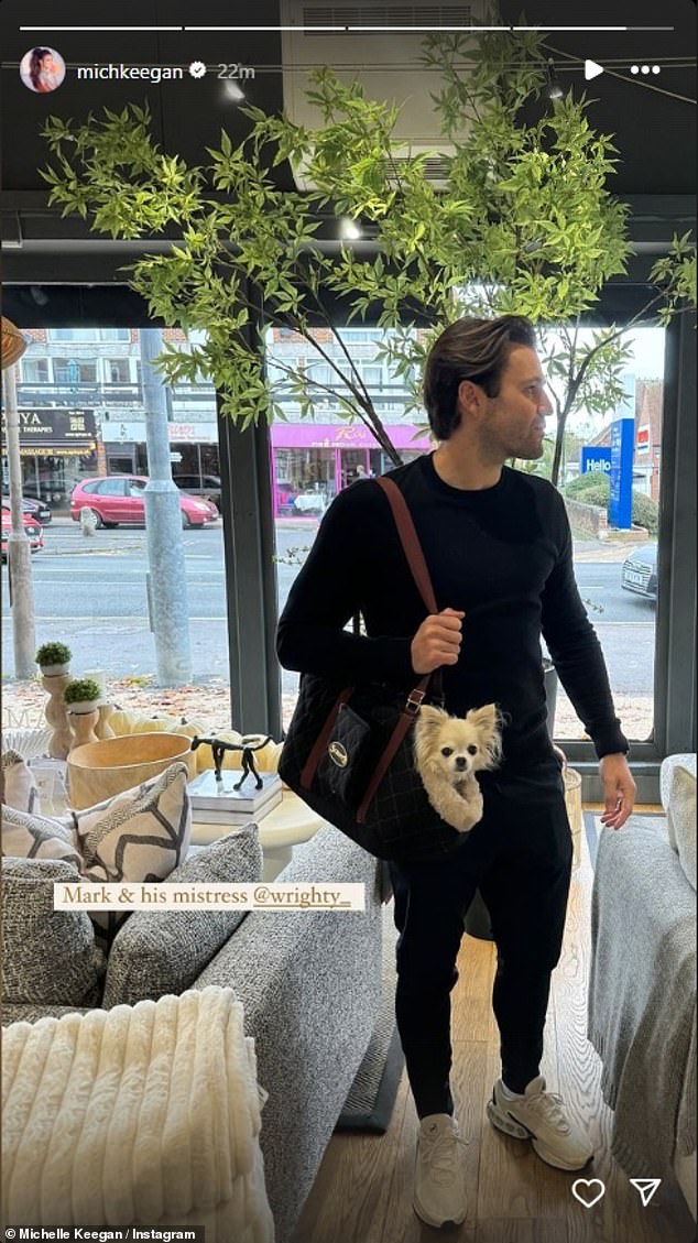 The actress, 37, poked fun at her partner while posting a photo of him carrying their small dog peeking out of its carrier.