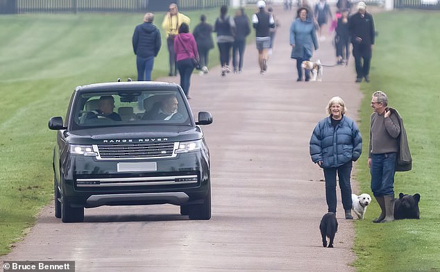 The Duke of York, 64, drove through the grounds of Windsor Castle on Saturday, stopping briefly on the Long Walk to smile at the public through his car window.