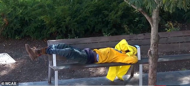 An apparently homeless person sleeps on a bench in downtown Burlington, Vermont's largest city.