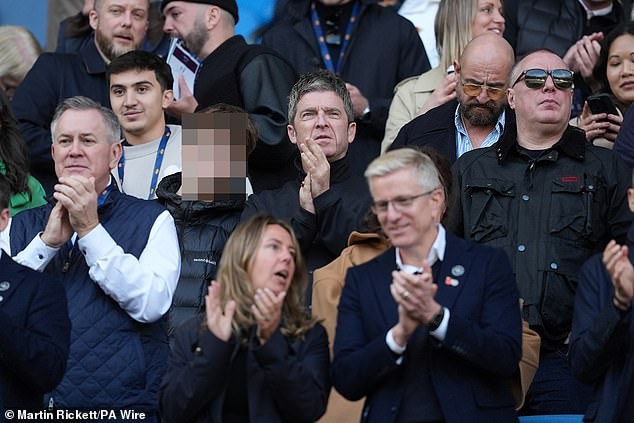 Noel wore a black button-up jacket as he watched his club take on the Saints and continue their bid to stay top of the table.