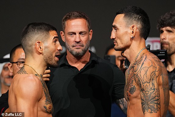 ABU DHABI, UNITED ARAB EMIRATES – OCTOBER 25: (L-R) Opponents Ilia Topuria of Spain and Max Holloway face off during the UFC 308 ceremonial weigh-in at Etihad Arena on October 25, 2024 in Abu Dhabi, United Arab Emirates. (Photo by Chris Unger/Zuffa LLC)