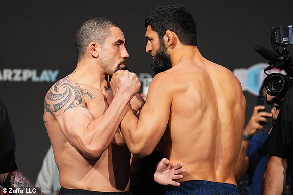 ABU DHABI, UNITED ARAB EMIRATES – OCTOBER 25: (L-R) Opponents Robert Whittaker of New Zealand and Khamzat Chimaev of Russia face off during the UFC 308 ceremonial weigh-in at the Etihad Arena on October 25, 2024 in Abu Dhabi, Emirates United Arabs. (Photo by Chris Unger/Zuffa LLC)