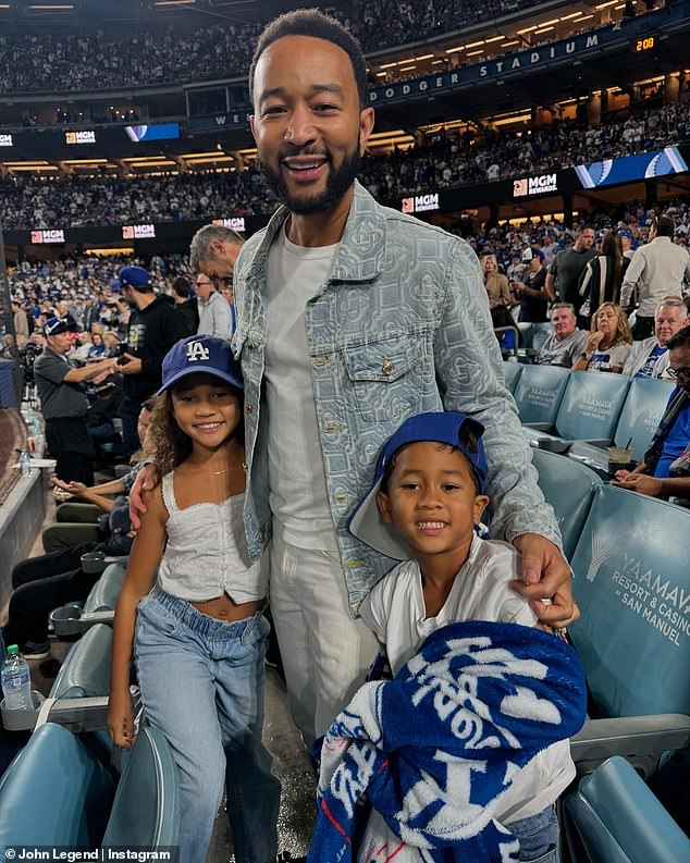 He paused to take some memorable photos with children Luna, eight, and Miles, six, as the trio watched the Los Angeles Dodgers defeat the New York Yankees at Dodger Stadium.