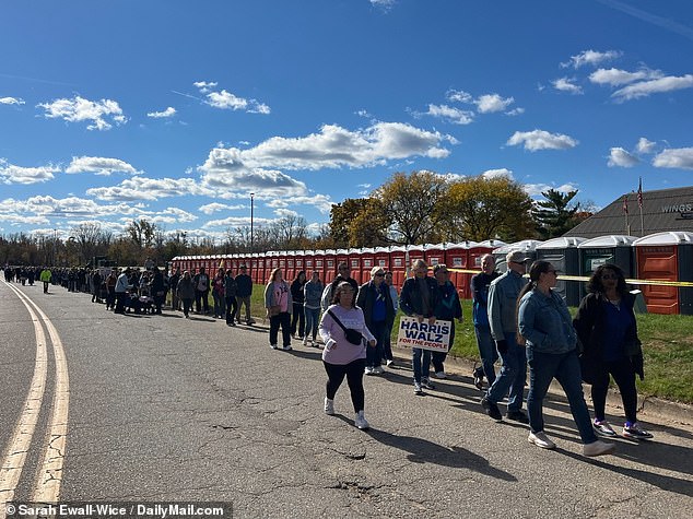 A long line of Harris supporters waiting to enter her rally with Michelle Obama in Kalamazoo, MI, on Saturday.