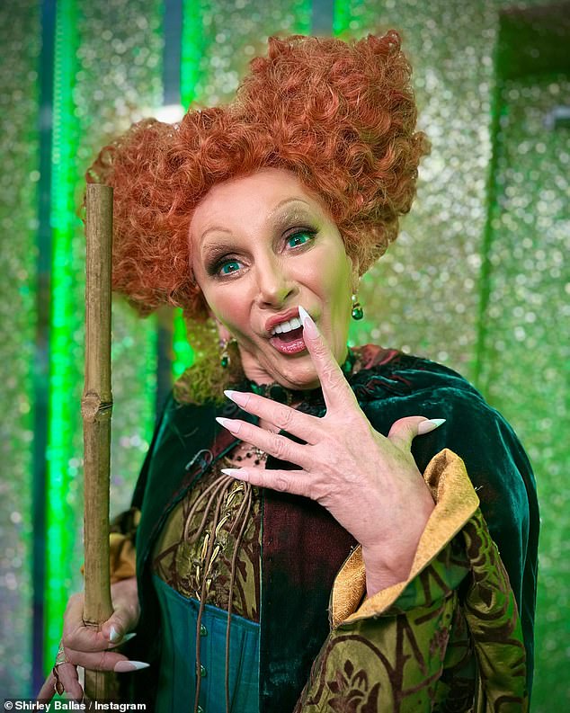 Shirley looked incredible as she rocked the eye-catching witch outfit complete with the iconic orange wig.