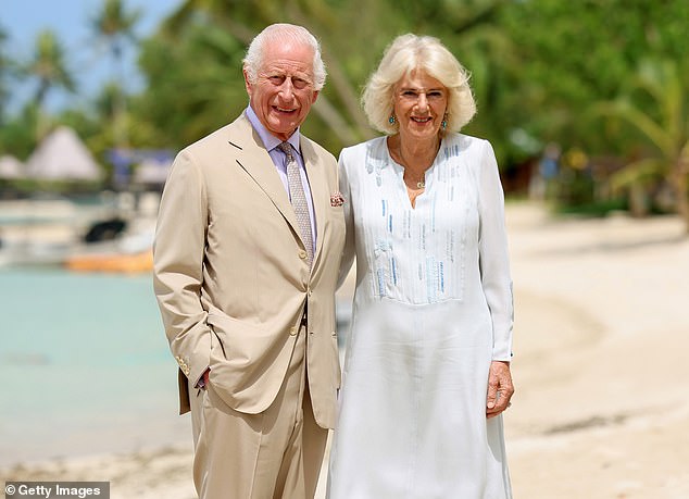 Camilla wore a white linen dress with details in various shades of blue for the photographs, while Charles opted for a tan linen suit, with a matching shirt and tie.