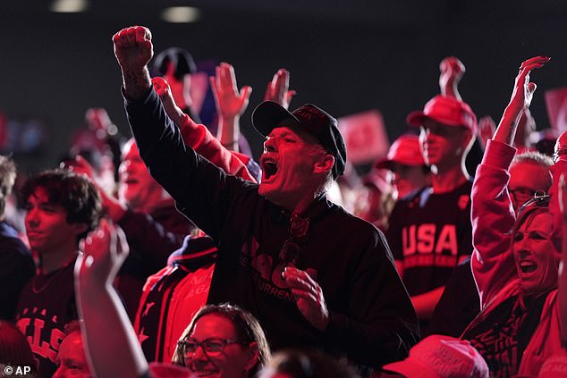 Attendees applauded as Trump criticized Kamala Harris and said she would return the auto industry to greatness.