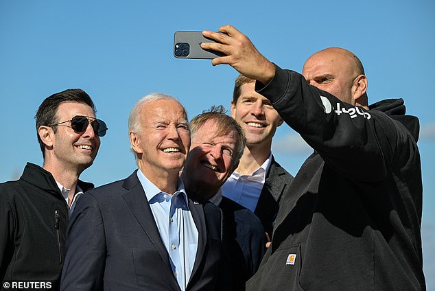 Senator John Fetterman (right) takes a selfie with (from left) Senator Chris Deluzio, President Joe Biden, Pennsylvania State Senate Democratic Leader Jay Costa, and former Representative Conor Lamb as Biden arrived at the Airport Pittsburgh International on Saturday.