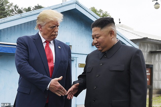 North Korean leader Kim Jong Un, right, and then-U.S. President Donald Trump prepare to shake hands in the border village of Panmunjom in the Demilitarized Zone, South Korea, in June 2019.