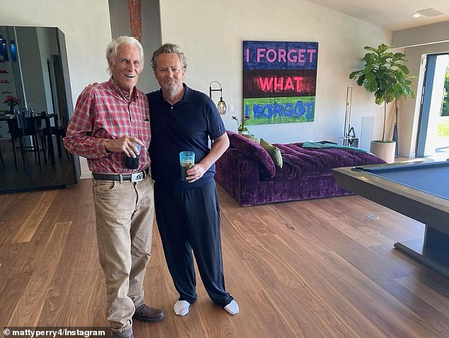 A photo with her father, John Bennett Perry, gave fans a glimpse of her home's decor, which includes a huge purple velvet daybed and patterned artwork.