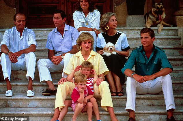 King Juan Carlos I of Spain, Prince Charles, Diana, William and Harry sitting on the steps of the Marivent Palace on August 10, 1987.