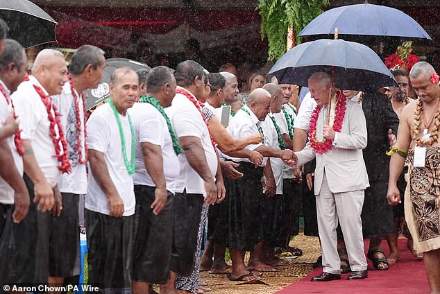 King Charles III meets people during a farewell ceremony at Siumu Village on the final day of the royal visit to Australia and Samoa.