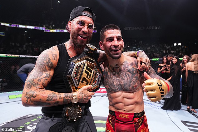 The Real Madrid superfan posed with Los Blancos legend Sergio Ramos, left, after the fight.