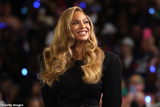 Beyoncé smiles at the crowd as she takes the stage at Kamala Harris rally in Houston