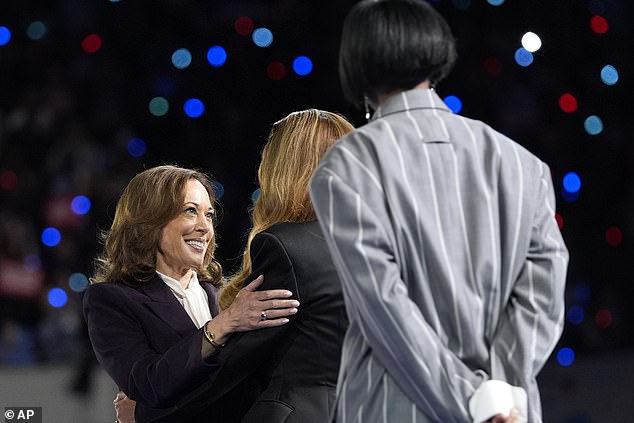 The vice president greets Beyoncé after going on stage in Houston