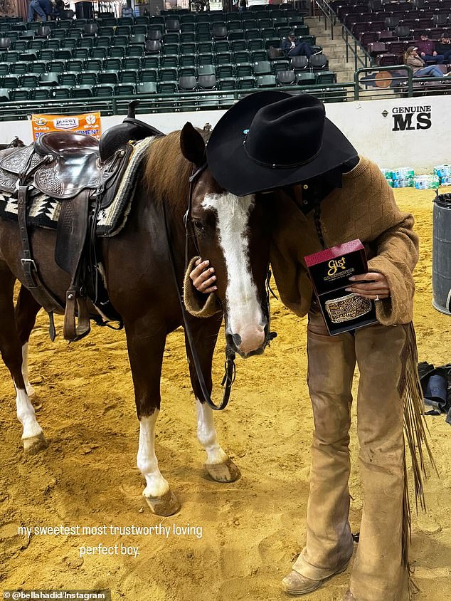 After emerging victorious, she posed with her chestnut stallion named Metallic Tito while looking unrecognizable compared to her typical eye-catching runway look.