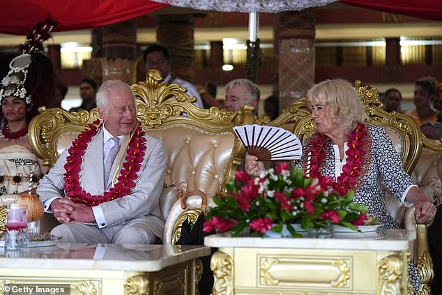 Charles and Camilla were offered seats on large golden thrones where they sat and listened to several extravagantly dressed village elders welcome them with honor.