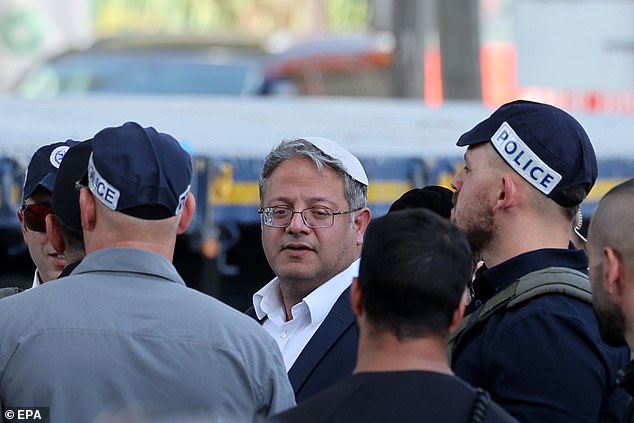 Israel's National Security Minister Itamar Ben Gvir watches the scene of a truck ramming in front of the Glilot military base near Tel Aviv, Israel, on October 27, 2024.